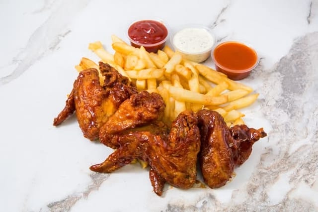 4 Pieces Of BBQ Chicken Wings with Fries.